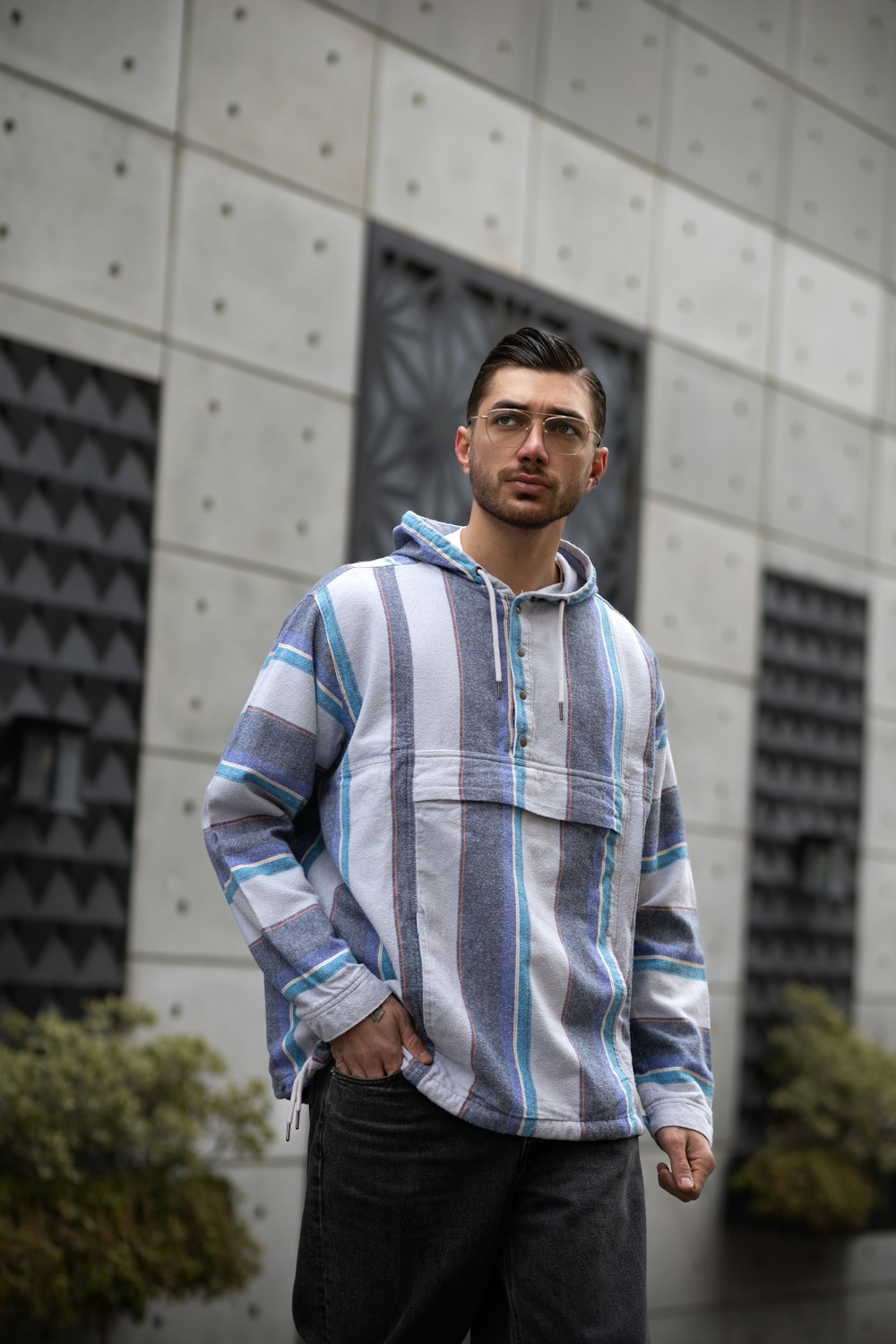 a man standing in front of a building