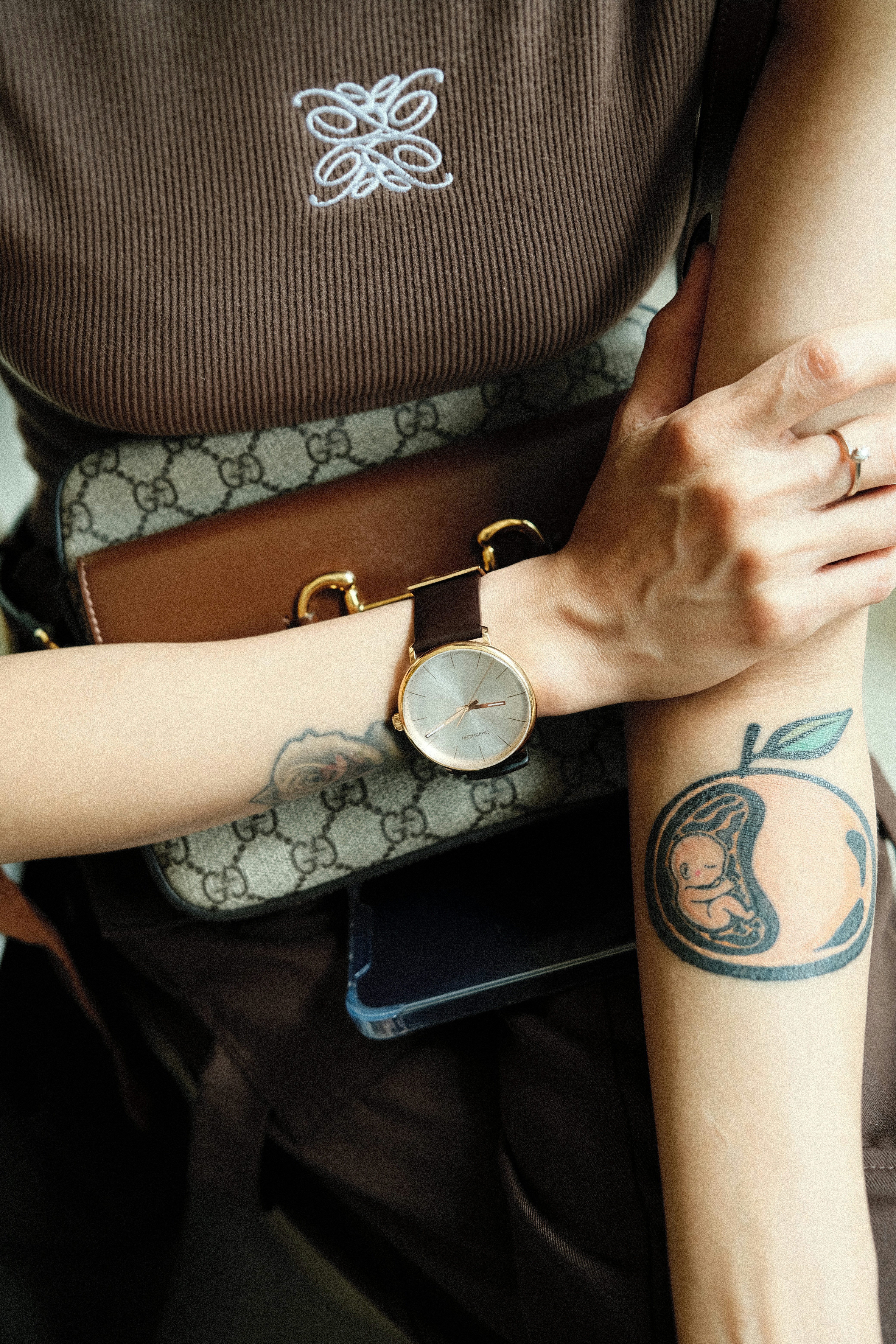 a woman with a tattoo on her arm