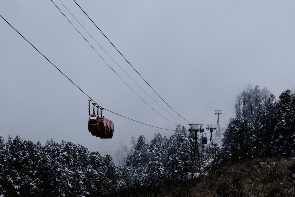 a ski lift going up a snowy mountain