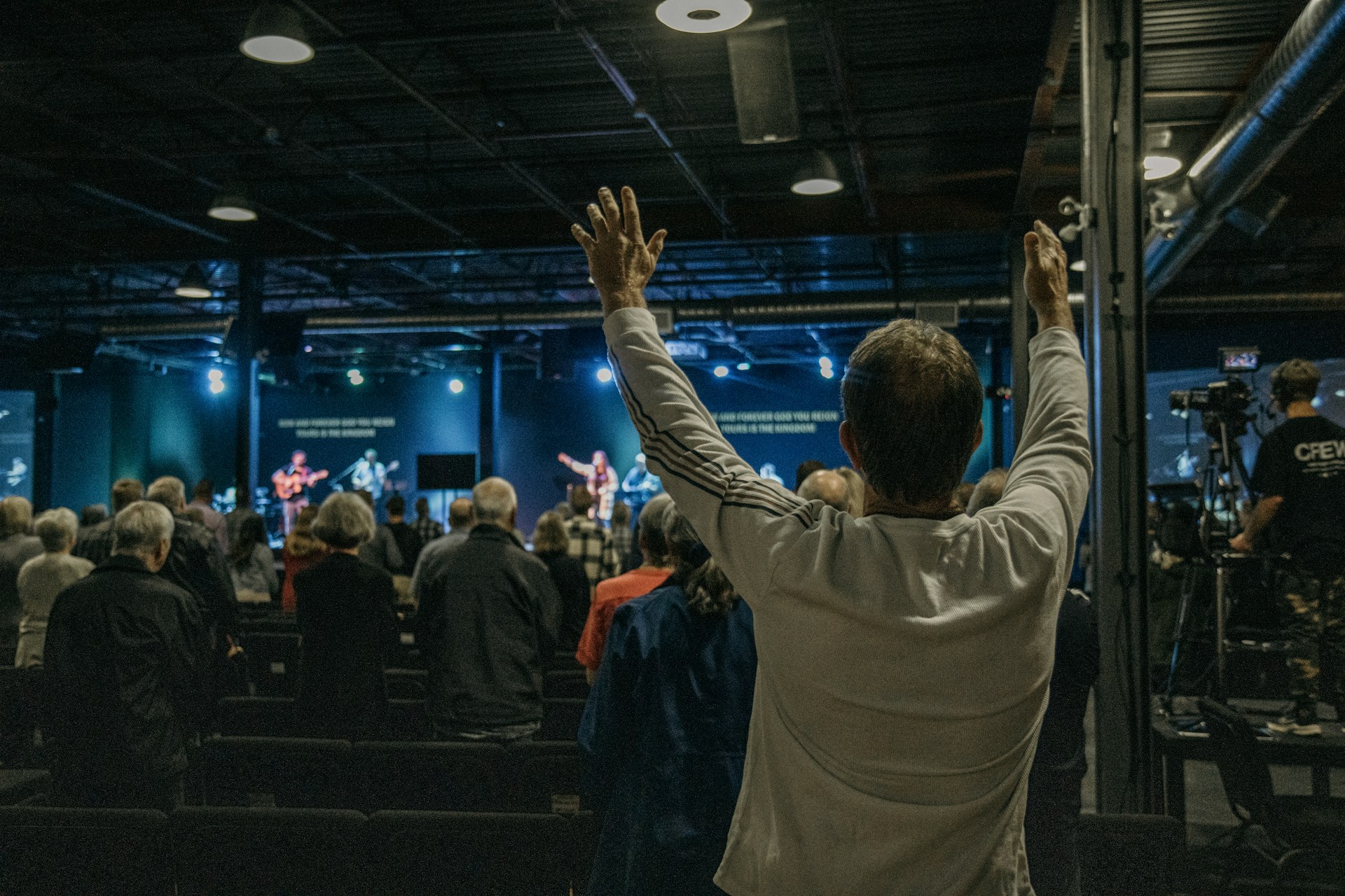 a man standing in front of a crowd of people