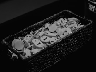 Clay monogrammed keychains resting on a soft fabric background.