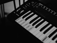 a black and white photo of a piano