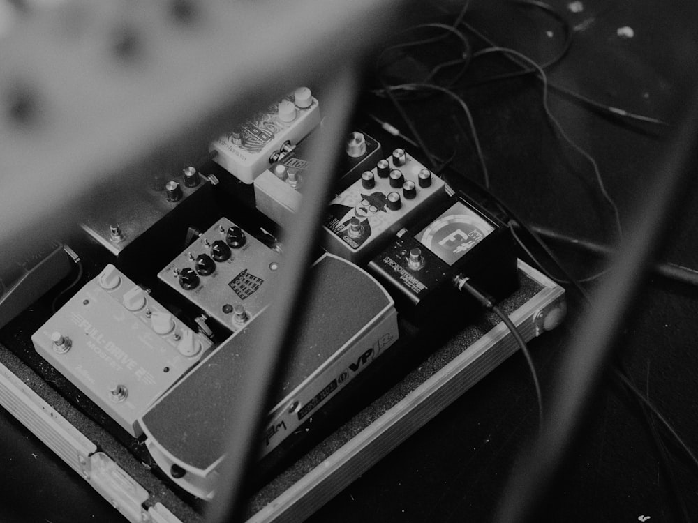 a black and white photo of a guitar pedal