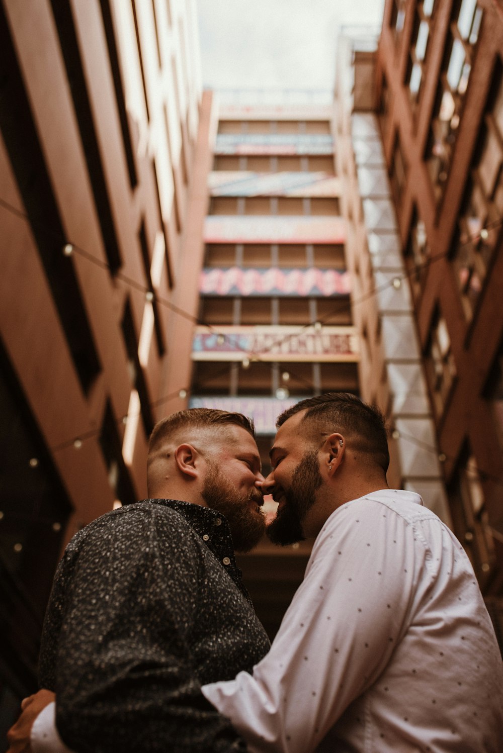 a couple of men standing next to each other