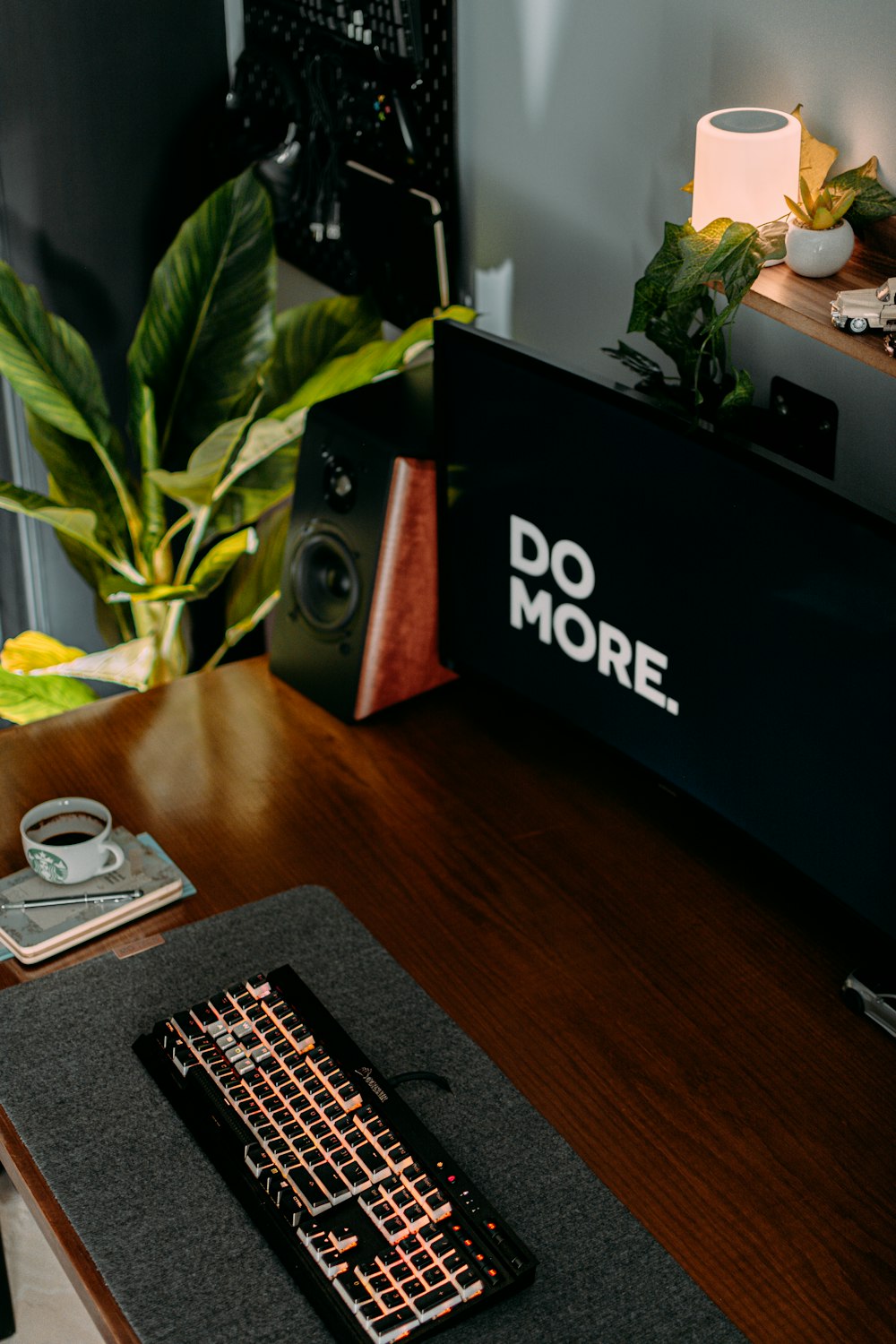 a desk with a keyboard and a mouse pad