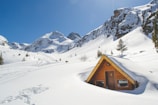 Family enjoying a mountain cabin surrounded by snow