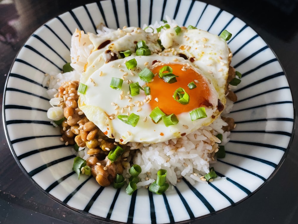 a plate with rice, beans, and an egg on top
