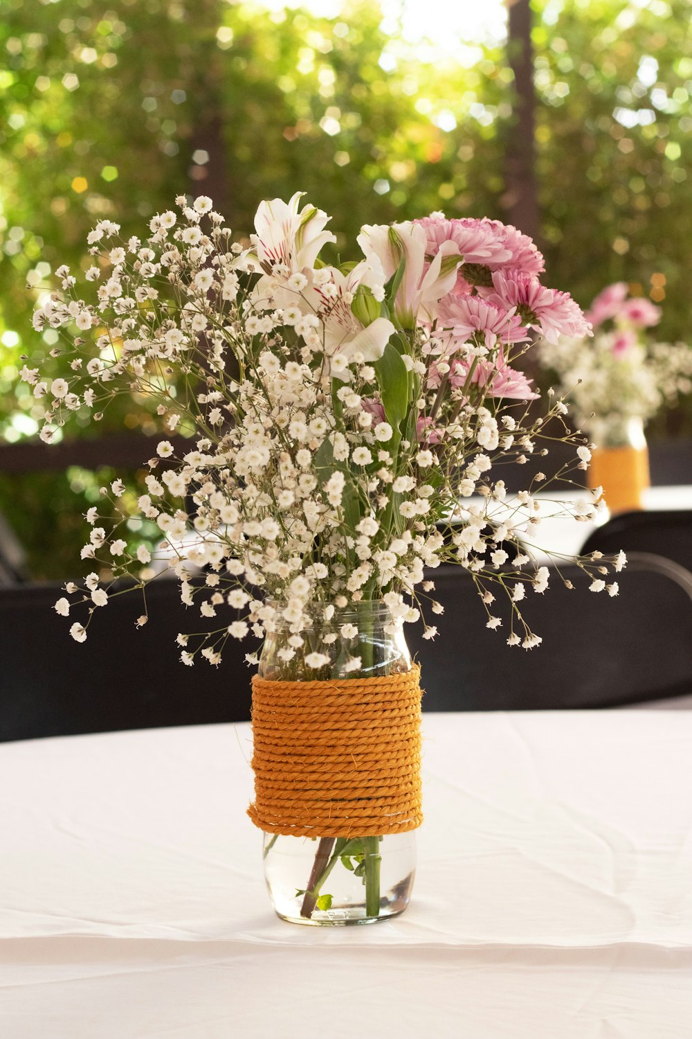 a vase filled with flowers on top of a table