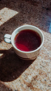 A heat-resistant, leak-proof cup sitting on a kitchen counter with morning light streaming in.