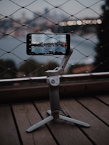 a cell phone sitting on top of a tripod