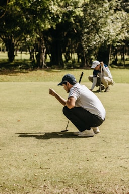 a man kneeling down holding a baseball bat