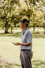 Professional notary agent assisting a client outdoors with documents in a sunny Florida neighborhood.
