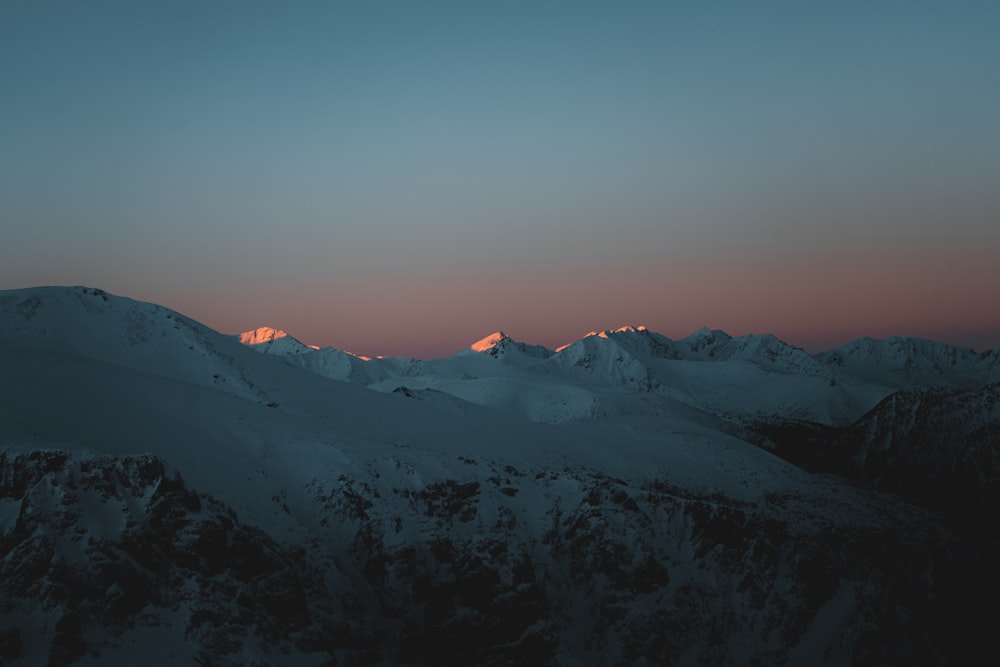 a view of a mountain range at sunset