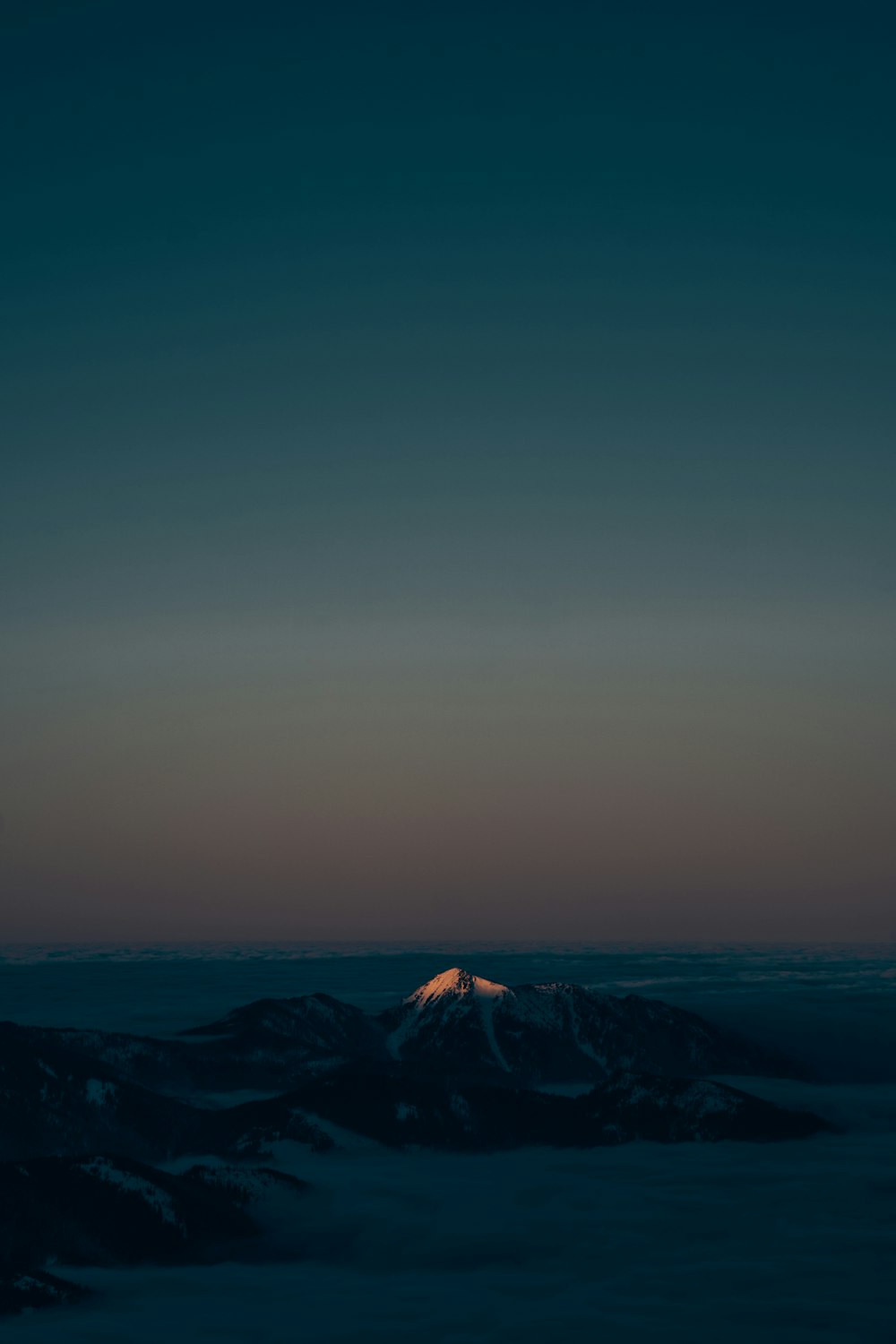 a view of the top of a mountain at night