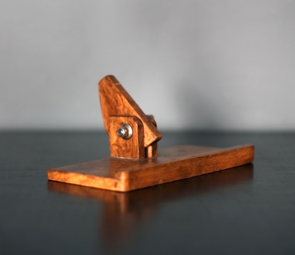 a wooden object sitting on top of a table