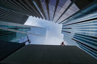 a couple of tall buildings sitting next to each other
