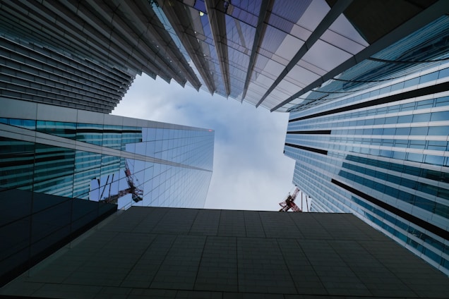a couple of tall buildings sitting next to each other