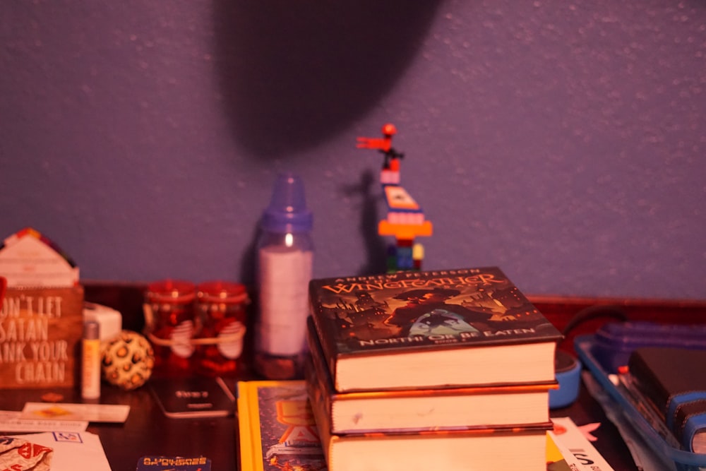 a stack of books sitting on top of a table