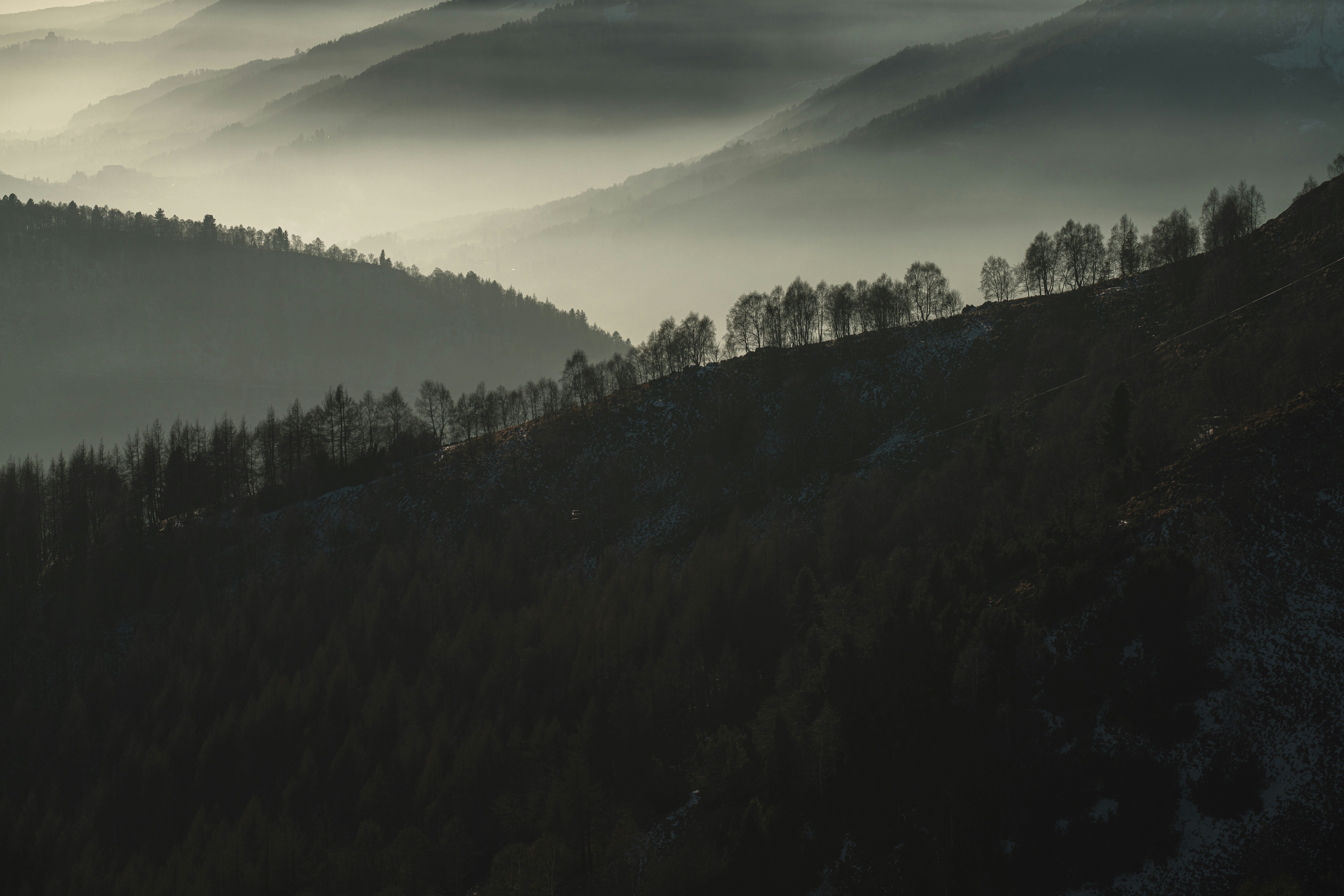 a black and white photo of a mountain range