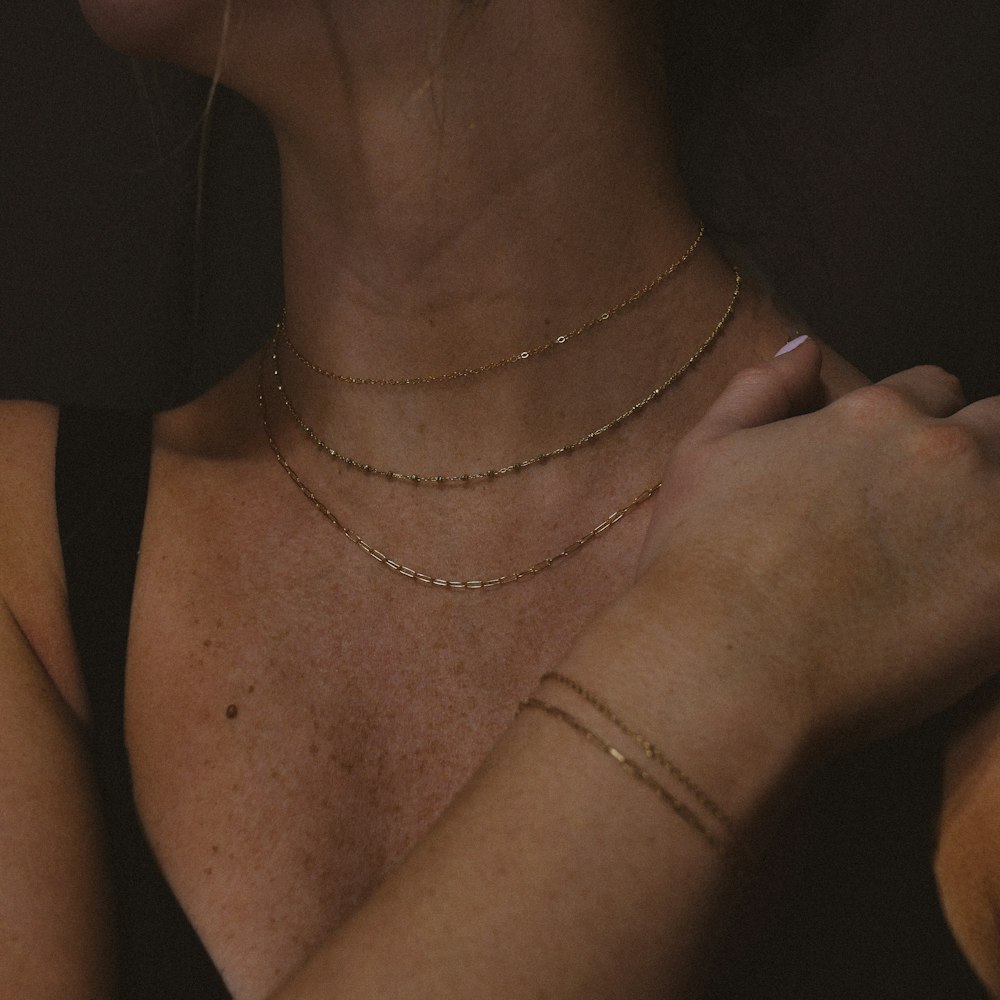 a close up of a person wearing a necklace