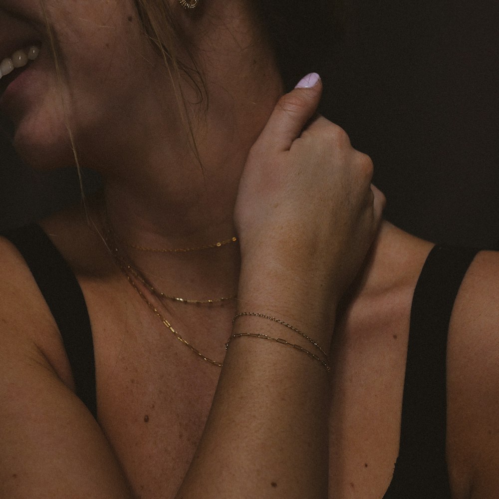 a close up of a person wearing a bracelet