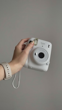 a person holding a camera in their hand