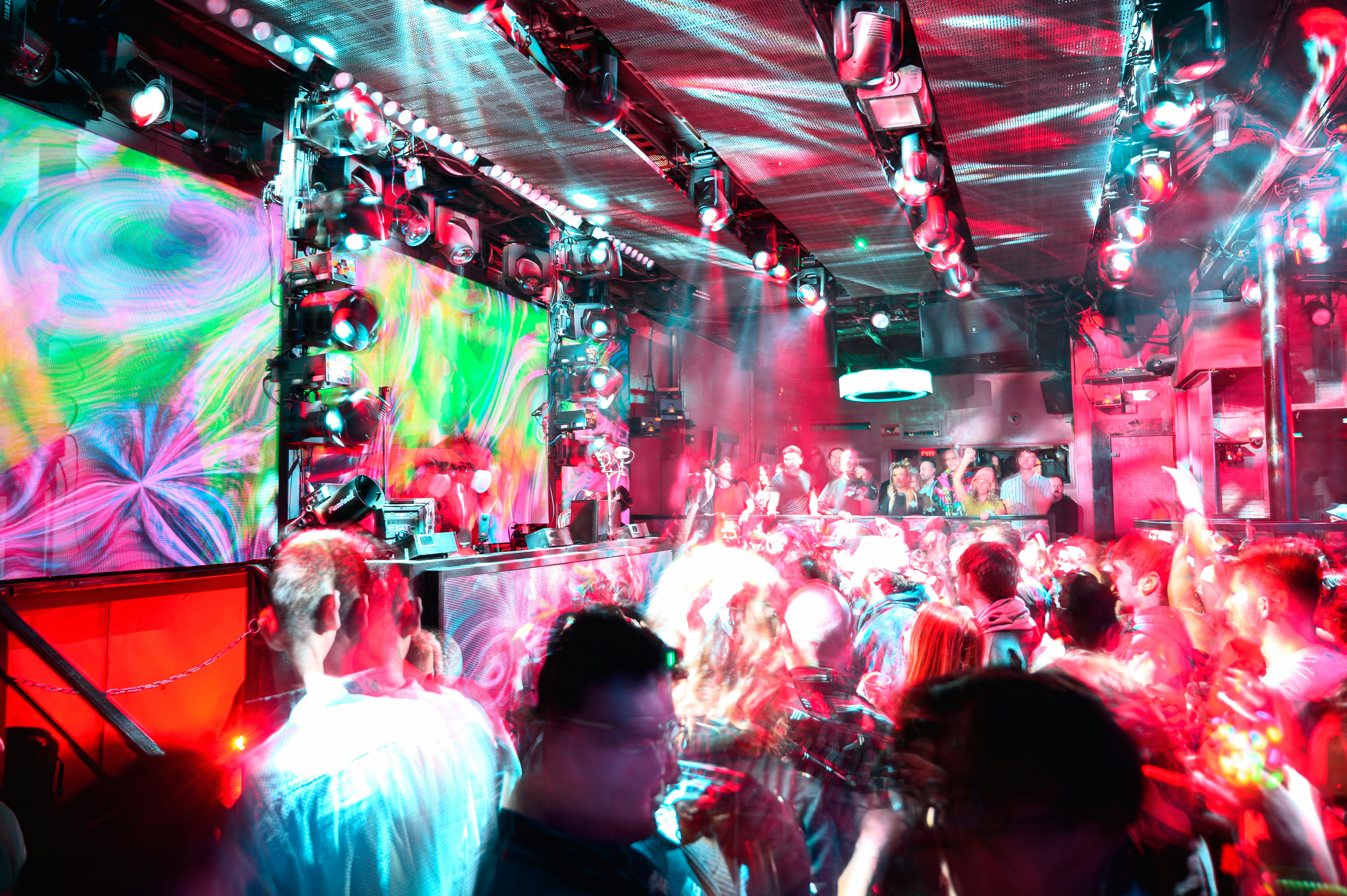 a group of people standing around in a room