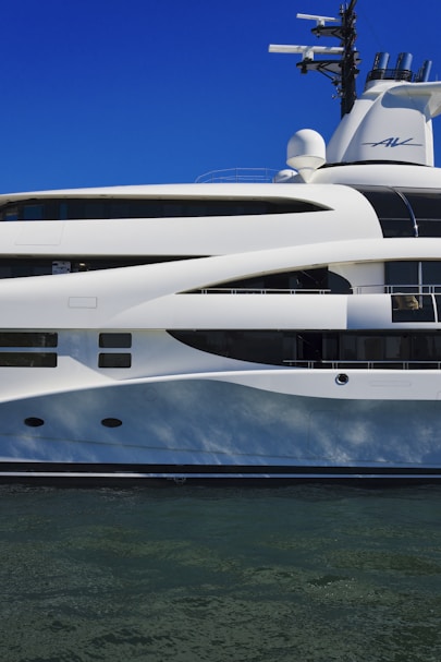 a large white boat floating on top of a body of water