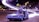 A toy model of a futuristic car with gull-wing doors open is positioned on a surface with a vibrant night city background. Light trails and blurred streetlights create a dynamic, sci-fi atmosphere.
