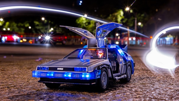 a toy car with a blue light on top of it