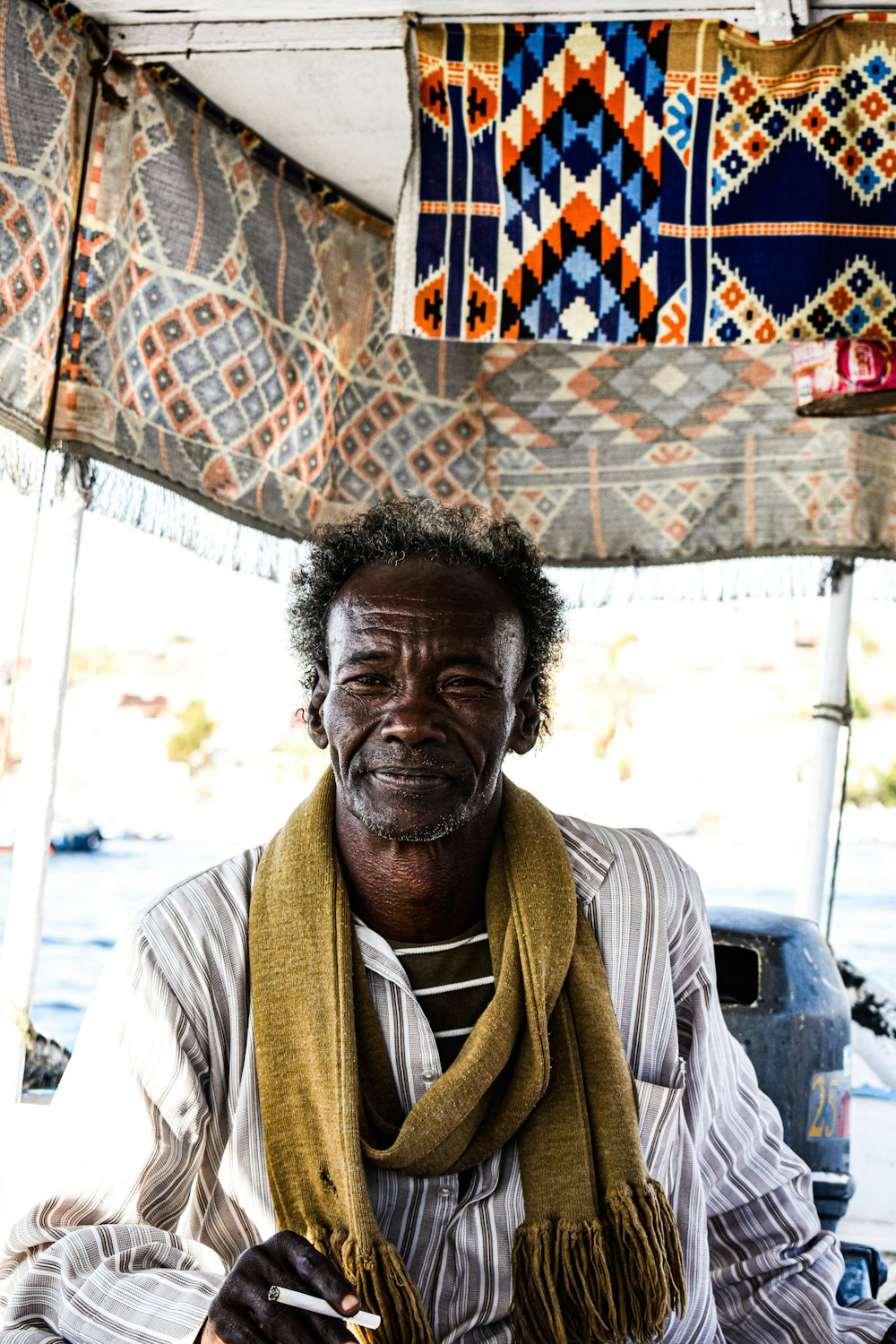 a man wearing a scarf and a scarf around his neck