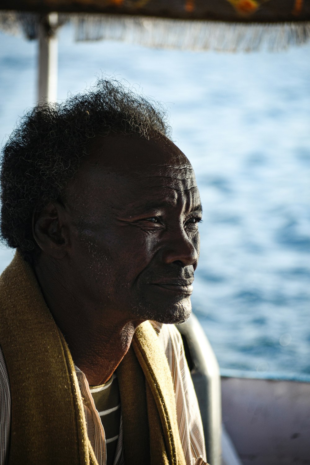 a man sitting on a boat in the water