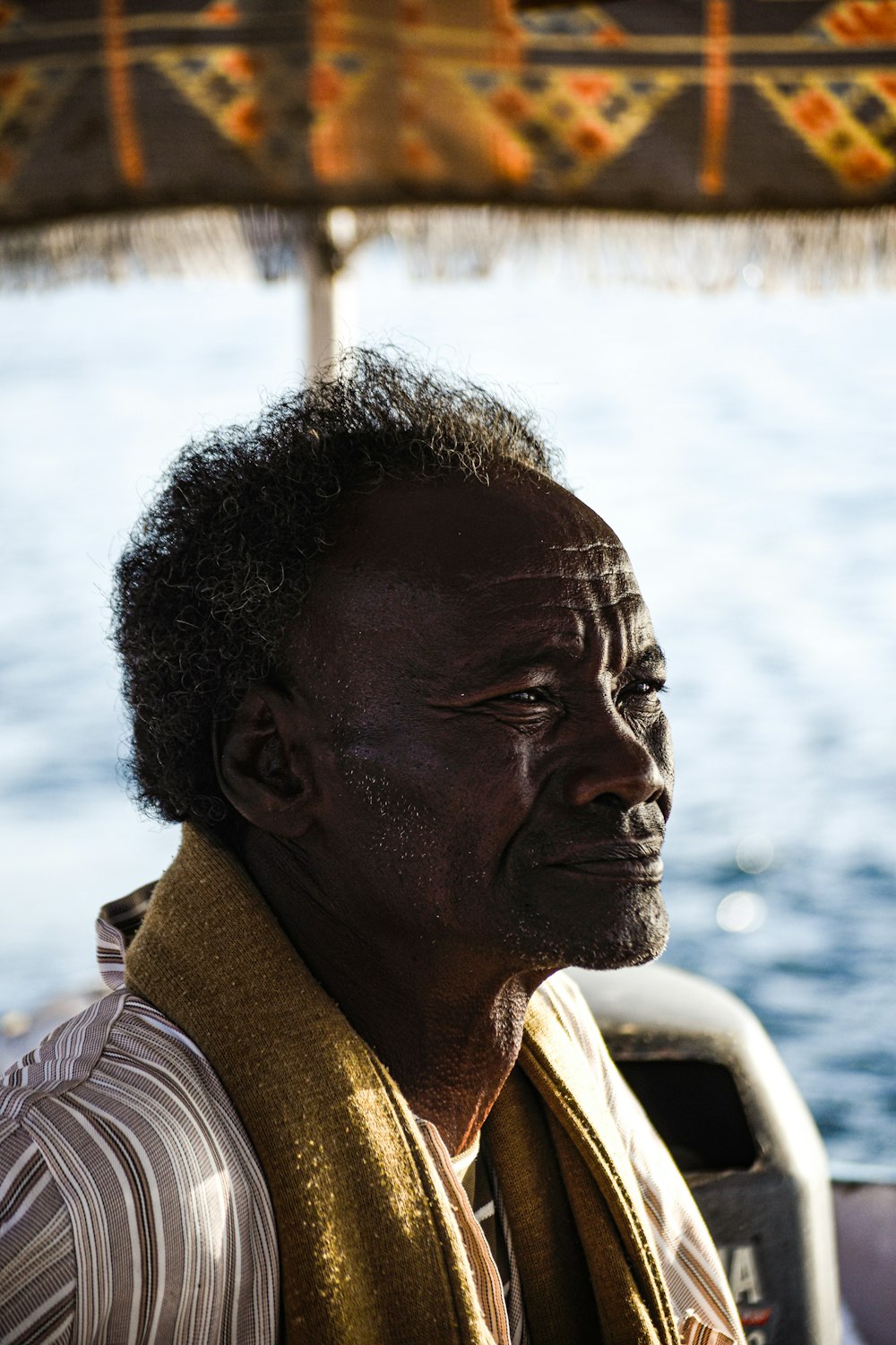 a man sitting on a boat in the water