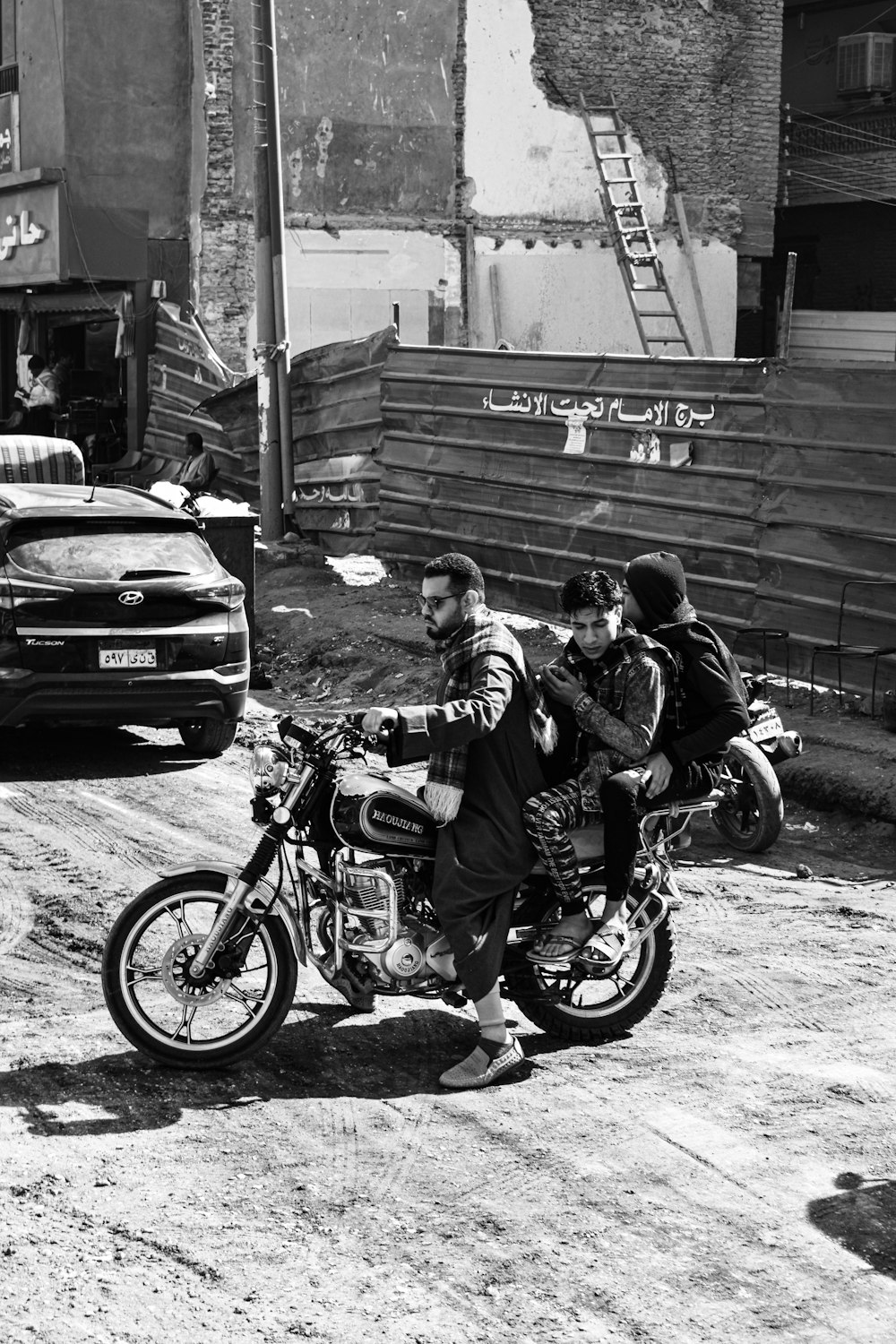 a group of people riding on the back of a motorcycle