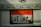 A close-up view of a car's license plate featuring English and Arabic text. The rectangular plate has a prominent orange and white color scheme with the word 'EGYPT' at the top. Decorative art with a skull motif frames the plate above. Below the plate, there is a 'Skunk Racing' logo.