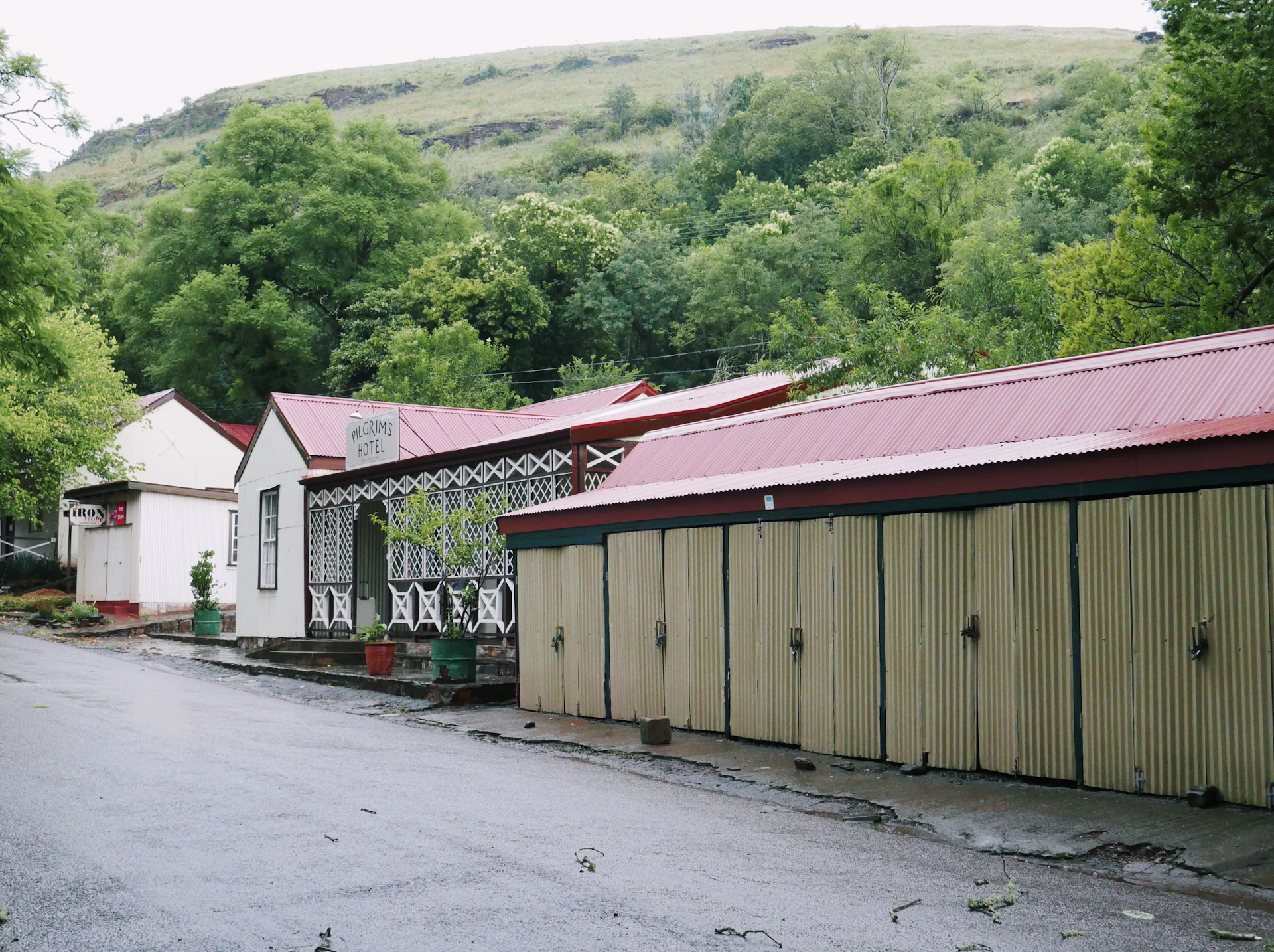 a row of buildings sitting on the side of a road