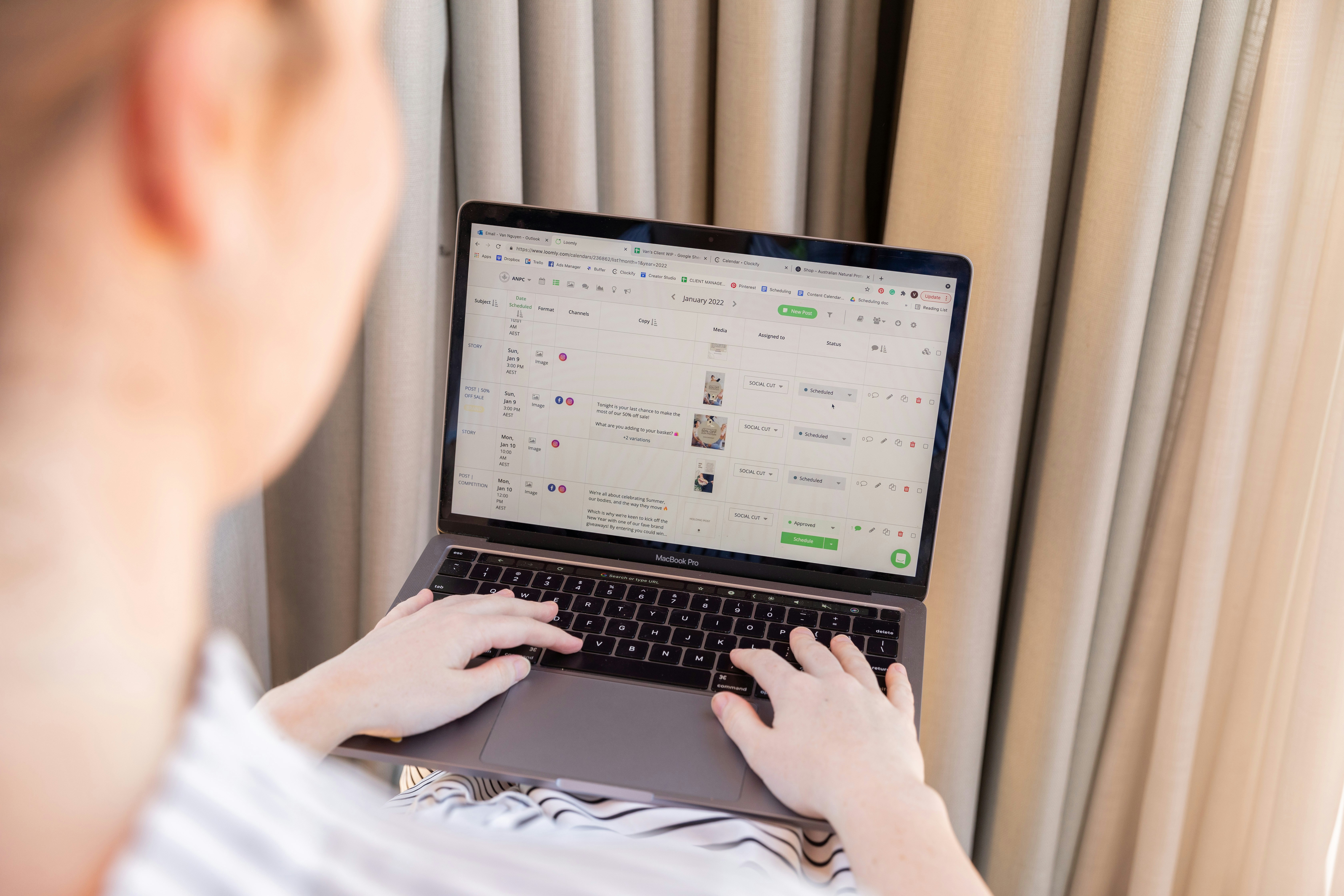 a person sitting in front of a laptop computer