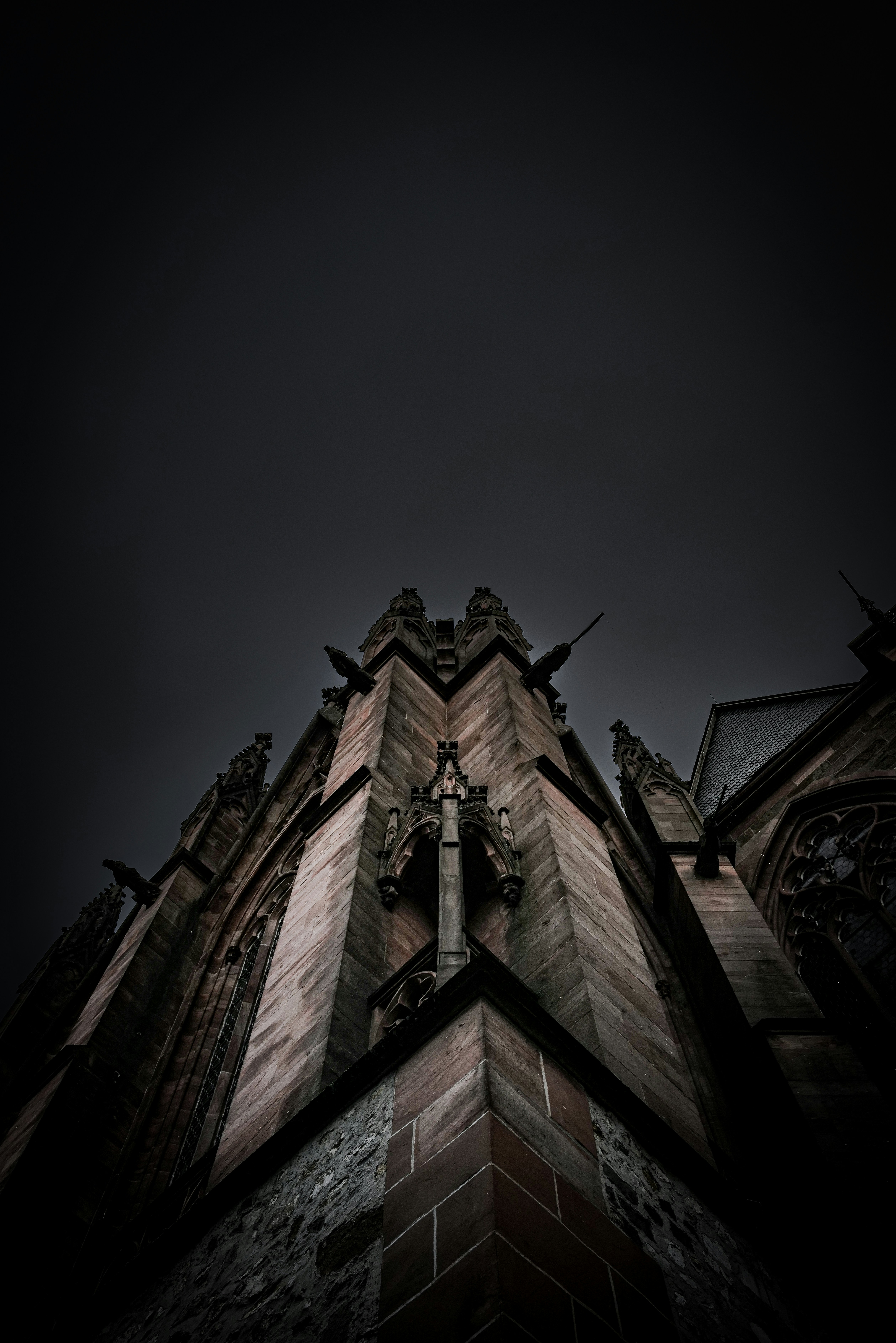 a very tall building with a clock on it's side