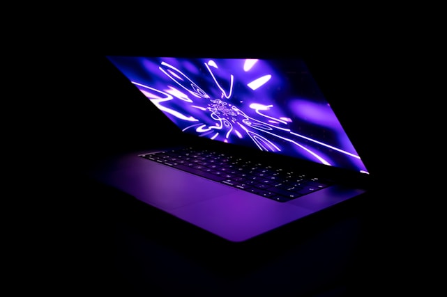 A sleek navy blue and electric blue digital interface glowing on a laptop screen.