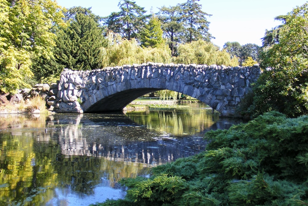 a stone bridge over a body of water