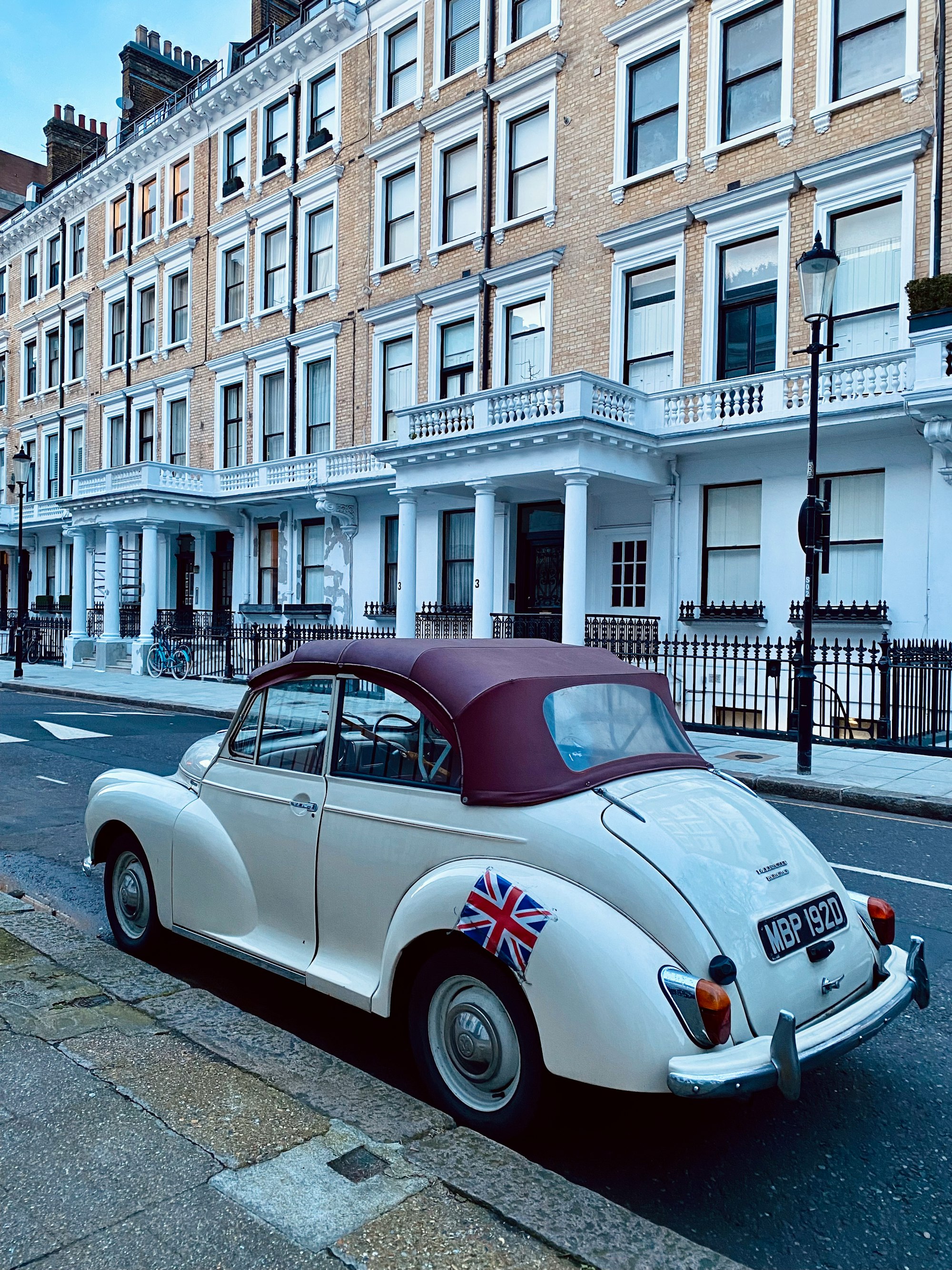 a white car parked on the side of the road