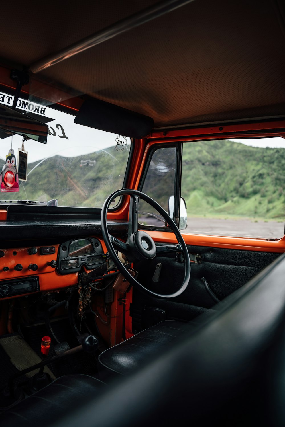 the interior of a truck with a steering wheel and dashboard