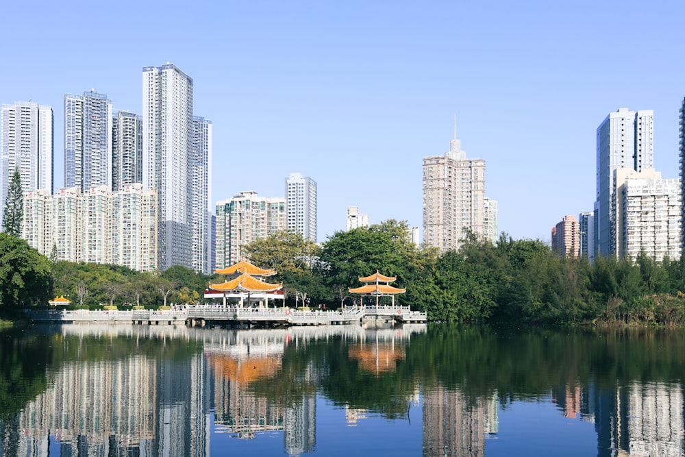 a view of a lake with buildings in the background