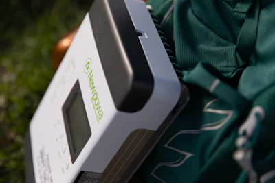 Close-up of a durable solar battery unit with visible connectors and labels.