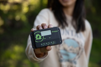 Close-up of hands holding sustainable energy technology device
