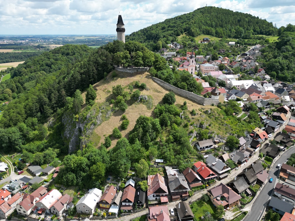 an aerial view of a small town on a hill