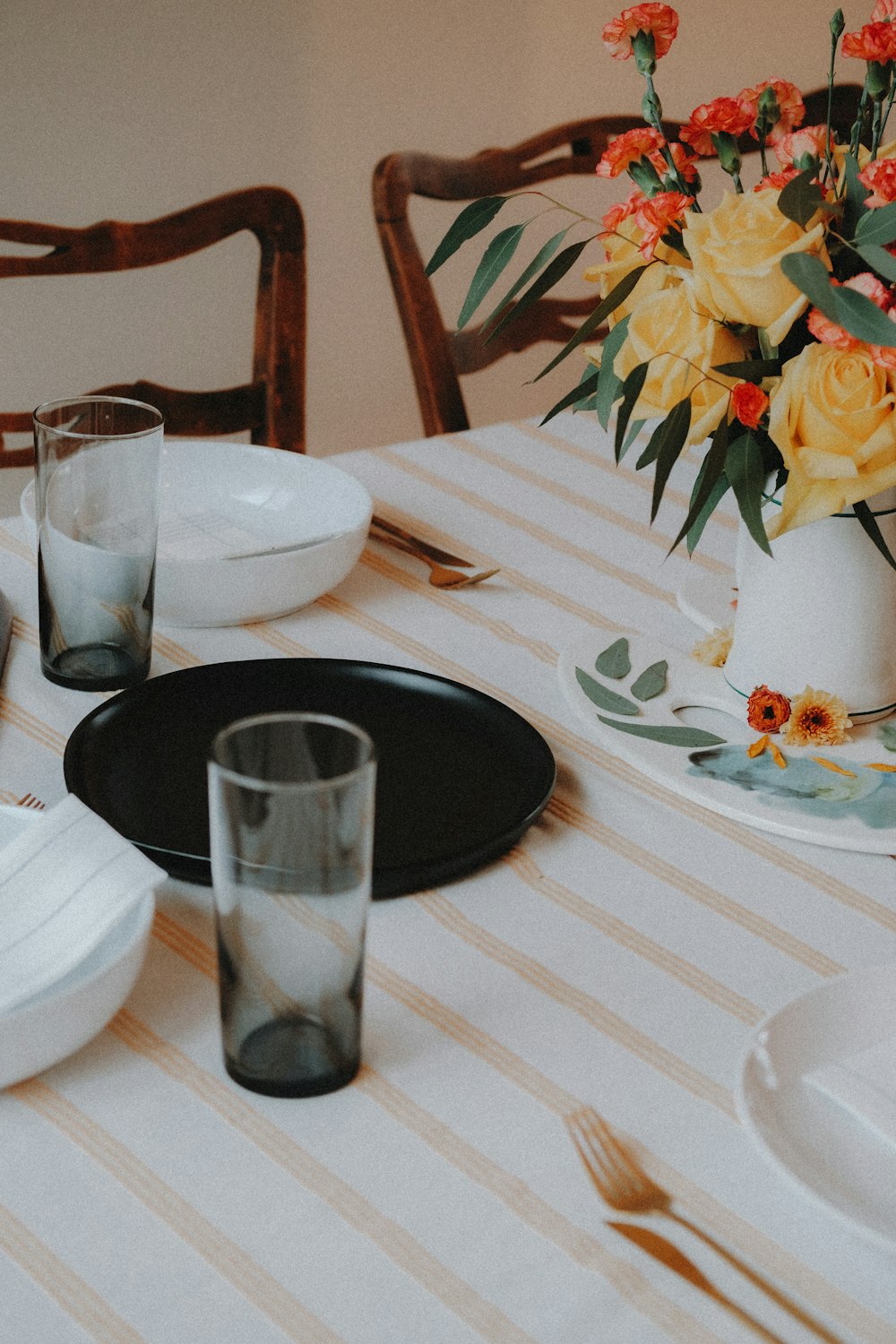 a table with a vase of flowers on it