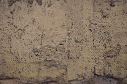 A close-up of textured stucco work on a building.
