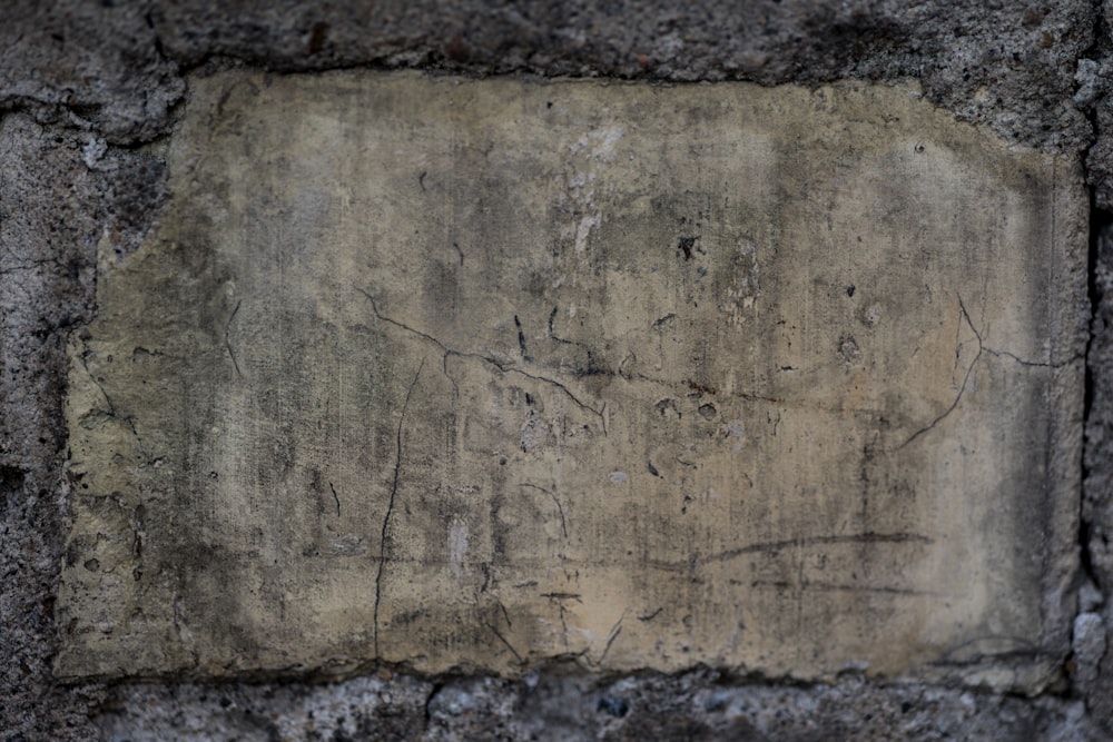 a cement wall with a square hole in the middle