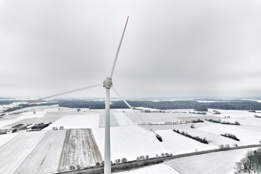 an aerial view of a wind farm in winter